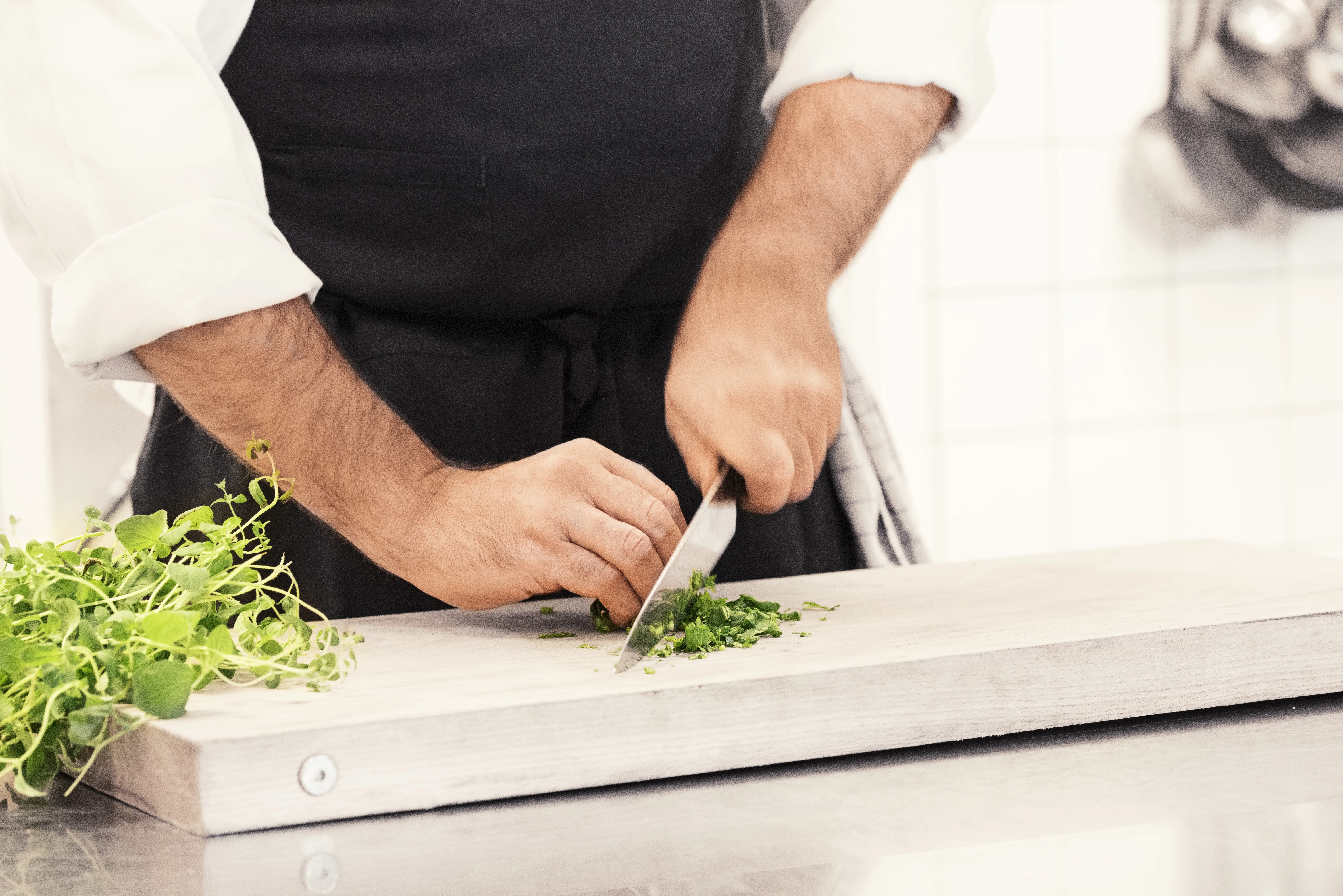 Hands Chopping Spice Greens